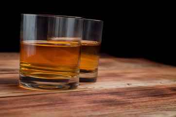 Glasses for whiskey on a wooden table