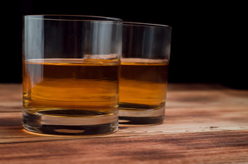Glasses for whiskey on a wooden table