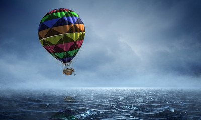 Fototapeta na wymiar Air balloon over water. Mixed media