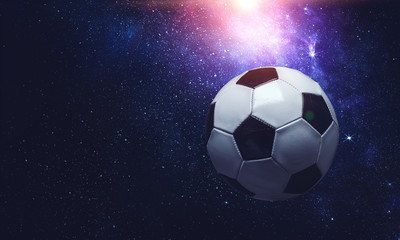 Fototapeta premium Soccer ball in cosmos