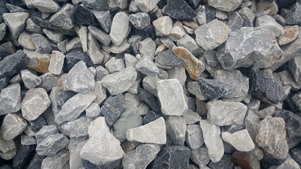 Large and small piles of limestone for use in lime kiln line  . Limestone gravel background Texture.