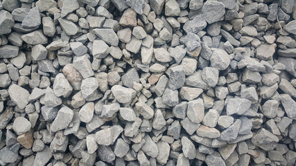 Large and small piles of limestone for use in lime kiln line  . Limestone gravel background Texture.