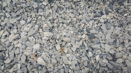 Small piles of limestone for use in lime kiln line  . Limestone gravel background Texture.
