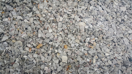 Small piles of limestone for use in lime kiln line  . Limestone gravel background Texture.