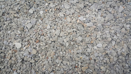 Small piles of limestone for use in lime kiln line  . Limestone gravel background Texture.