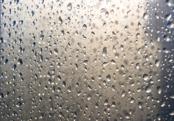 background of raindrops on window glass, close up