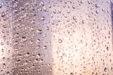background of raindrops on window glass, close up