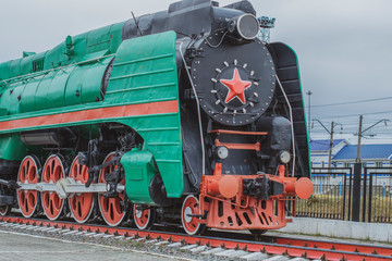 big steam locomotive with a red star, wheels of old steam locomotives. a pair of wheels. retro locomotives. vintage