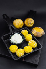 Fried potato balls or croquettes,  potato croquettes - mashed potatoes balls breaded and deep fried