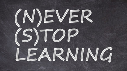 Never stop learning written on blackboard