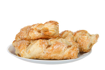 Apple fruit tarts on a porcelain plate isolated on white background. Apple pie is one of the most popular in America.