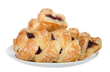 Cherry fruit tarts on a porcelain plate isolated on white background. One of the more popular flavored pies in America.