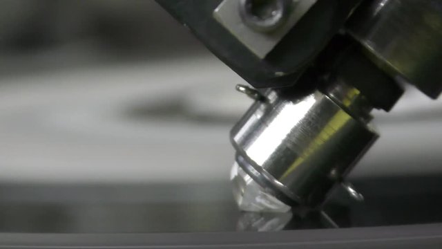 A diamond held by dop is polished