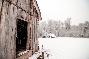 Snowing on Barn in Winter