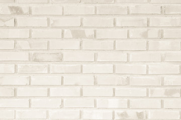 Cream and Brown brick wall texture background. Brickwork or stonework flooring interior rock old pattern clean concrete grid uneven bricks design stack.