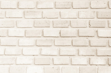 Cream and Brown brick wall texture background. Brickwork or stonework flooring interior rock old pattern clean concrete grid uneven bricks design stack.