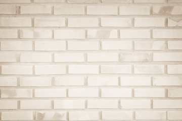 Naklejka premium Cream and Brown brick wall texture background. Brickwork or stonework flooring interior rock old pattern clean concrete grid uneven bricks design stack.