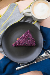 Vegan cake,  cake with nuts and dates, raw cake,  cake on a black plate