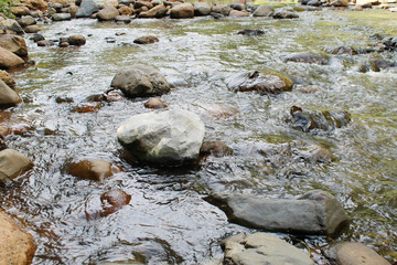 mountain creek with big boulders