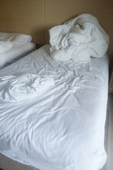 Fototapeta na wymiar Wrinkle messy blanket and white pillow