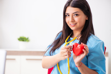 Young beautiful female doctor working in the clinic 