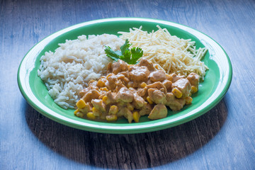 Chicken stroganoff with rice and french fries