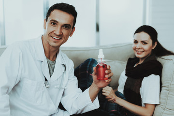Doctor Visiting Sick Young Woman in Scarf at Home.