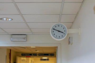 clock in a hospital corridor 