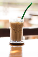 Iced chocolate on outdoor wood desk background