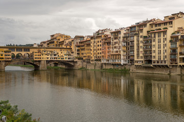 Naklejka premium FLORENCE, ITALY - OCTOBER 28, 2018: Beautiful view of the Ponte Vecchio bridge across the Arno River