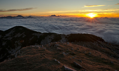 Naklejka na ściany i meble Beautiful sunrise with fog in the mountains