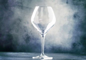 Empty wine glass for red wine, gray background, selective focus