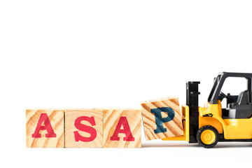Toy forklift hold letter block p to complete word ASAP (abbreviation of as soon as possible) on white background