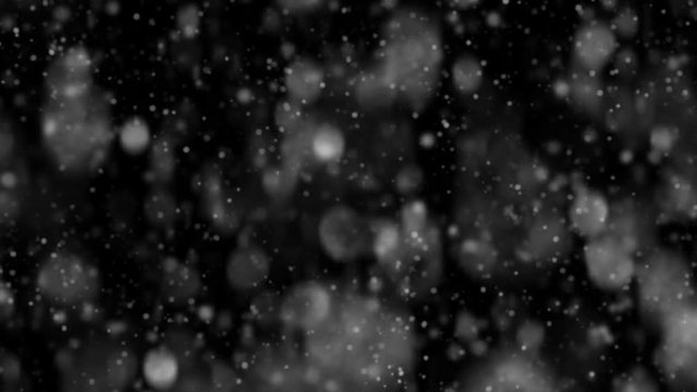 Realistic snowflake.  Falling snow. Dynamic bokeh. Isolated on a black background. Loopback footage. Cyclical