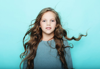 lifestyle  and people concept: litle girl kid with long curly ha