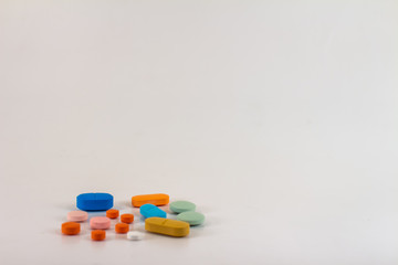 Drugs in the form of pills of different sizes, shapes and colors.