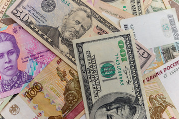 Multicurrency background of the us dollars, russian rubles and ukrainian hryvnias