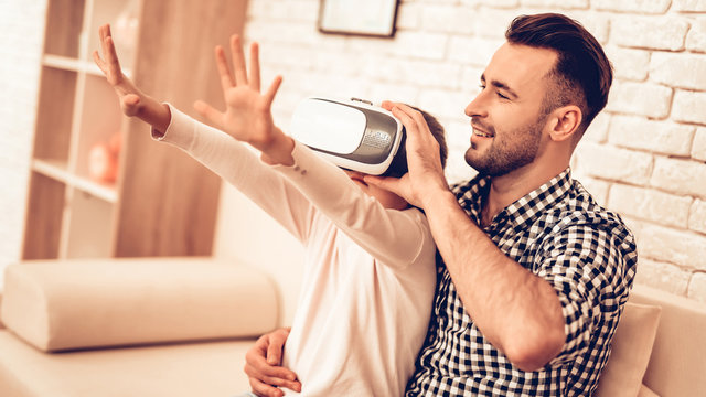 Man and Douhter in Mask Virtual Reality at Home.