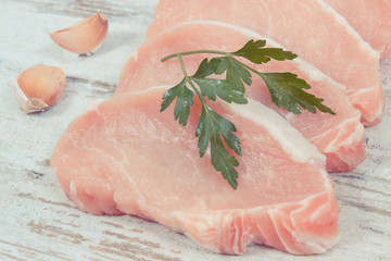 Slices of fresh loin with spices for cooking