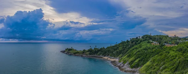 Foto op Canvas aerial view dark sunset at the rocky outcropping in the sea at Promthep cape.. Promthep cape is the most popular viewpoint in Phuket. the most tourist always come to see sunset at this landmark © Narong Niemhom