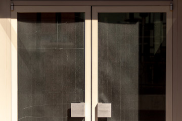 Retail doors with black paper over glass
