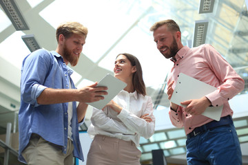Obraz premium Picture of young designers using tablet in office.