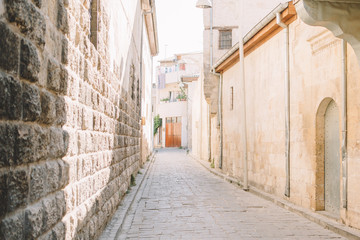 stone house and stone walled street