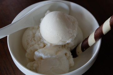 ice cream in bowl on wooden background