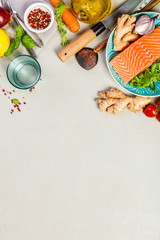 Raw salmon fillet and ingredients for cooking