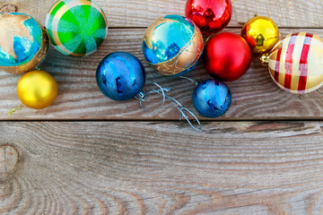 Christmas baubles on wooden background. Top view, copy space