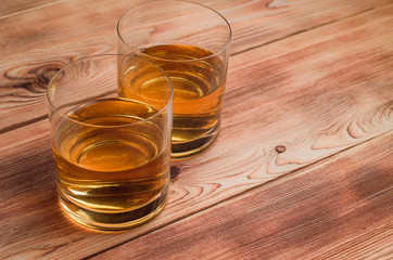 Glasses for whiskey on a wooden table