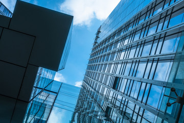 Modern office building against blue sky.