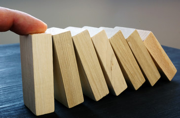 Hand support falling blocks with domino effect. Problem solving skills.