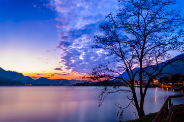 Panorama of the colorful sunrise on the lake on a cold winter day